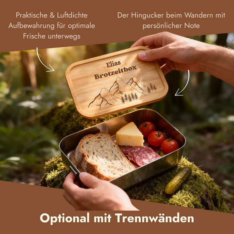 Personalisierte Edelstahl-Lunchbox mit Bambusdeckel und Gravur „Elias Brotzeitbox" samt Bergmotiv beim Wandern.