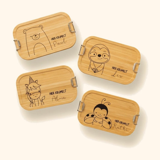 brotdose kinder personalisiert tiere vor cremefarbenem Hintergrund.