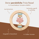 Personalisierbarer Greifling aus Buchenholz mit Katzenmotiv und pastellfarbenen Ringen von Trixie.