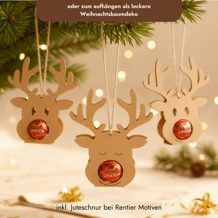 Rentier-Schokoladenhalter aus Holz mit Lindor-Kugel als Nase und Juteschnur zum Aufhängen am Weihnachtsbaum.