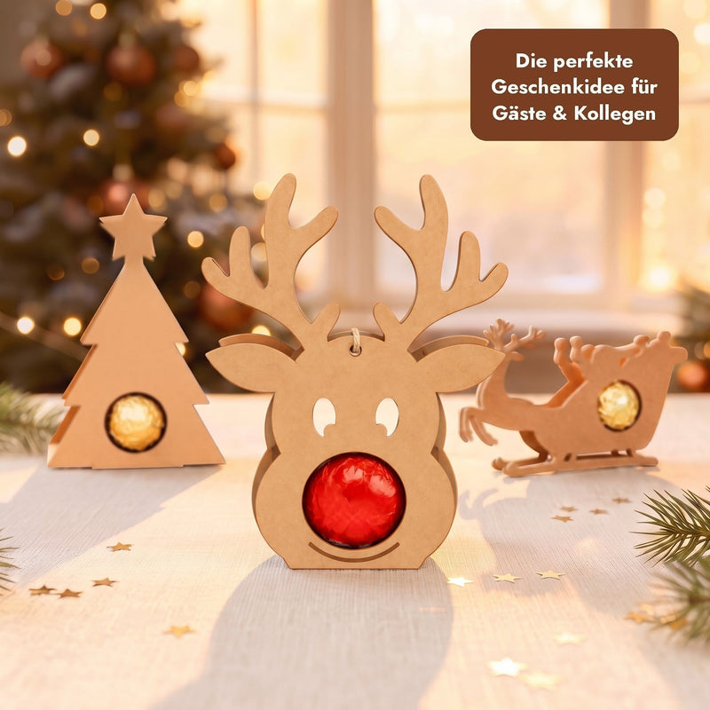 Rentier Schokoladenhalter mit Lindor-Kugel neben Weihnachtsbaum und Schlitten, Geschenkidee für Gäste und Kollegen
