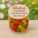 Vorratsglas mit graviertem Holzdeckel und Danke-Spruch fuer Mama, gefuellt mit bunten Gummibaerchen.