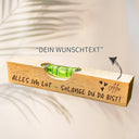 Personalisierte Wasserwaage aus Buchenholz mit Gravur und individuellem Wunschtext als originelles Geschenk.
